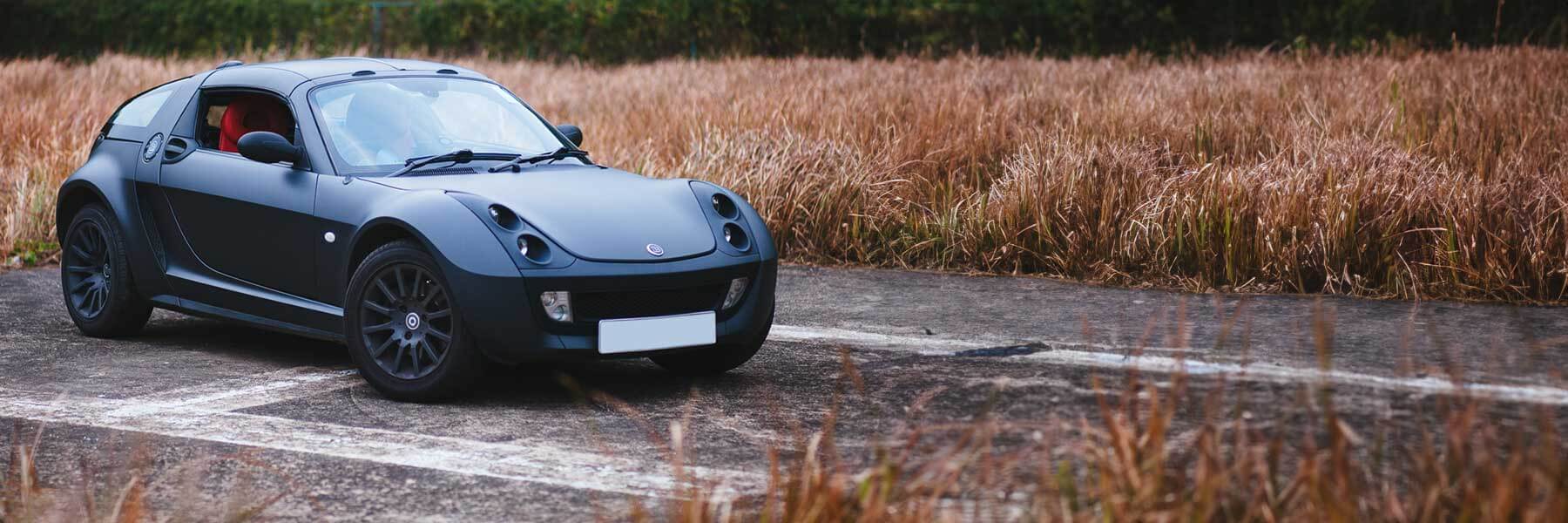 Featured banner showcasing the Smart Roadster with original Smart wheels.