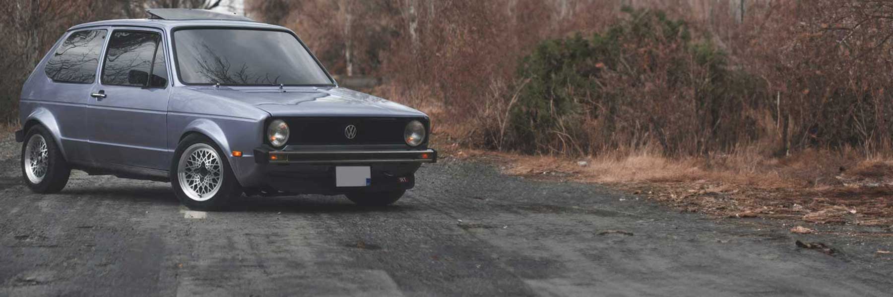 Banner image of a  VW Golf Mk1 Convertible MKI featuring original VW wheels.