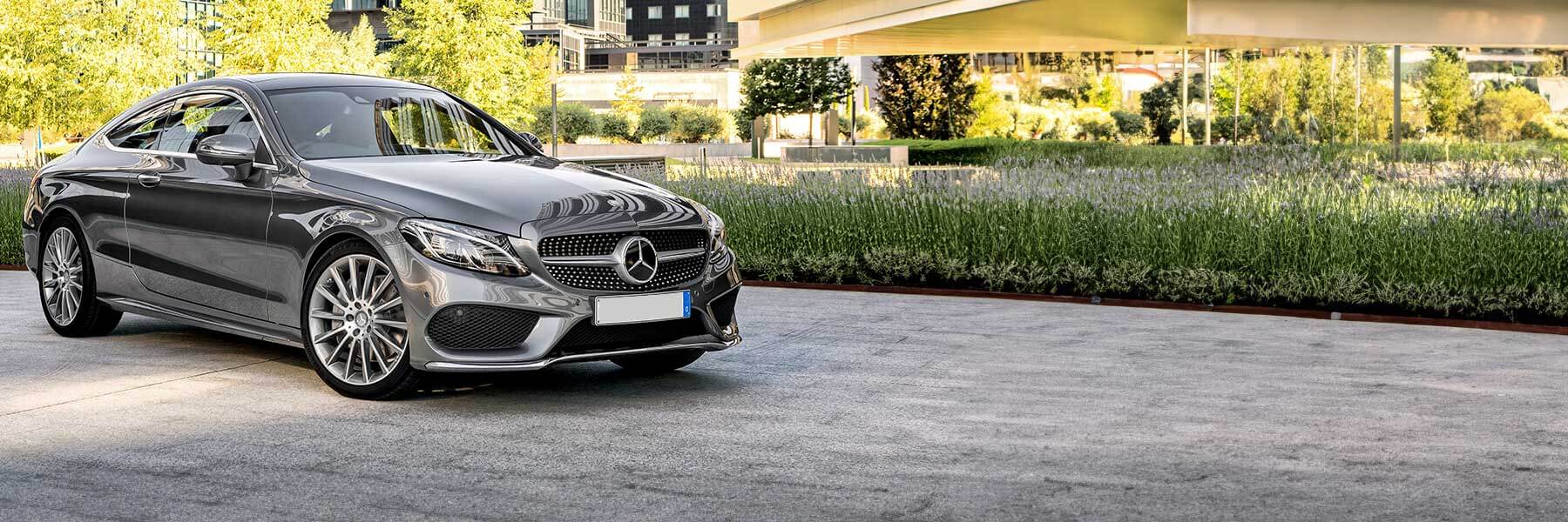 Banner image of a  Mercedes C-Class W203 featuring original Mercedes wheels.