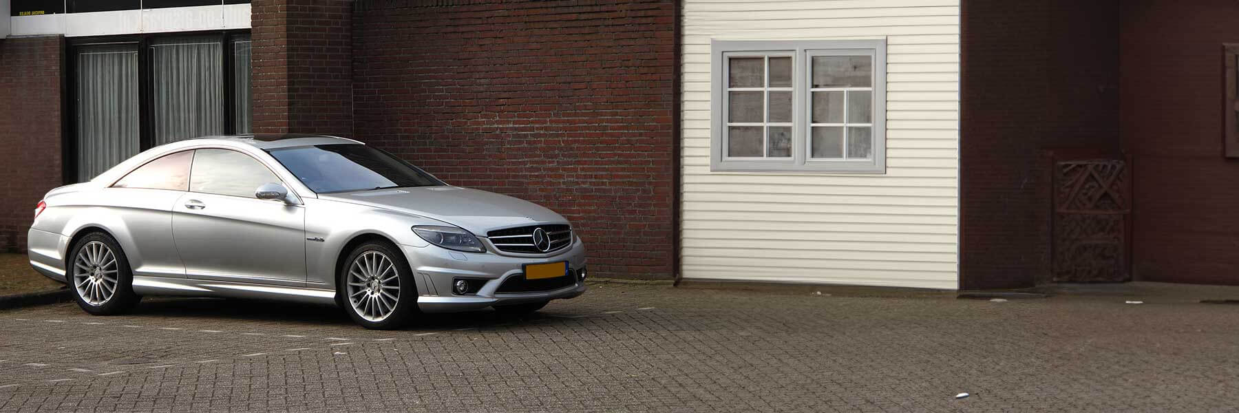 Banner image of a  Mercedes CL C216 featuring original Mercedes wheels.