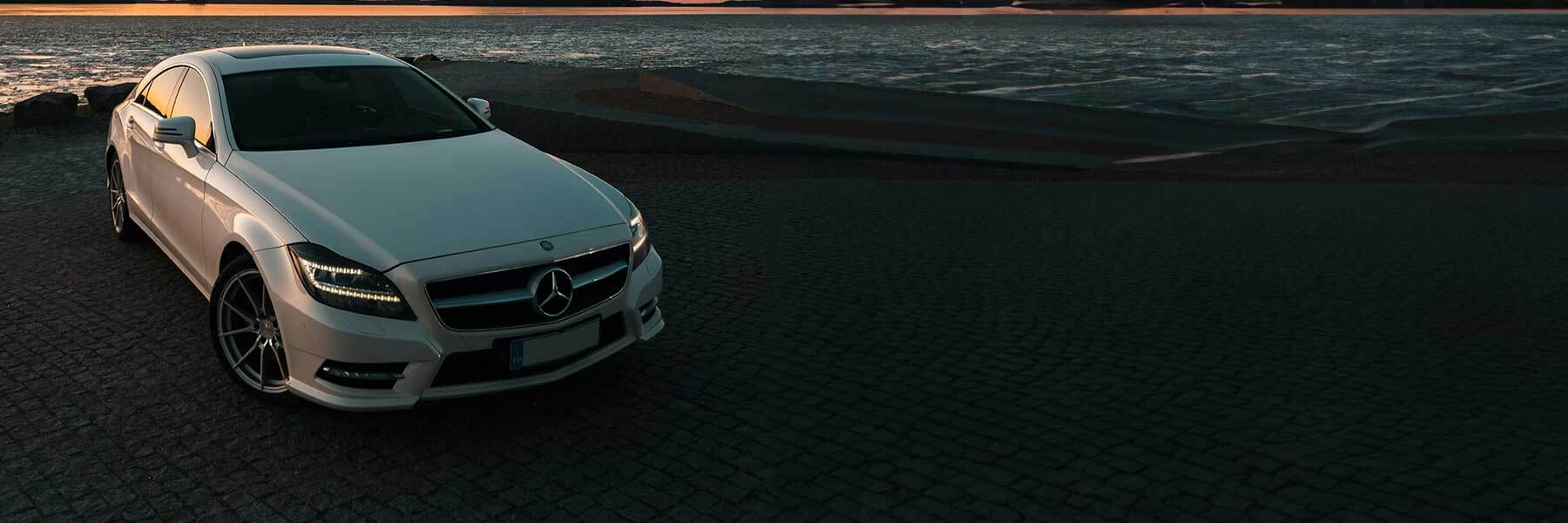 Banner image of a  Mercedes CLS C218 featuring original Mercedes wheels.