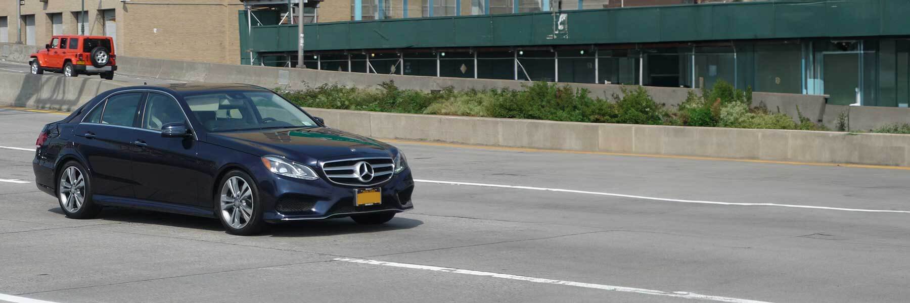 Banner image of a  Mercedes E-Class W213 featuring original Mercedes wheels.