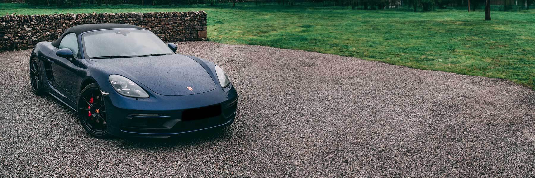 Featured banner showcasing the Porsche 718 Boxster with original Porsche wheels.