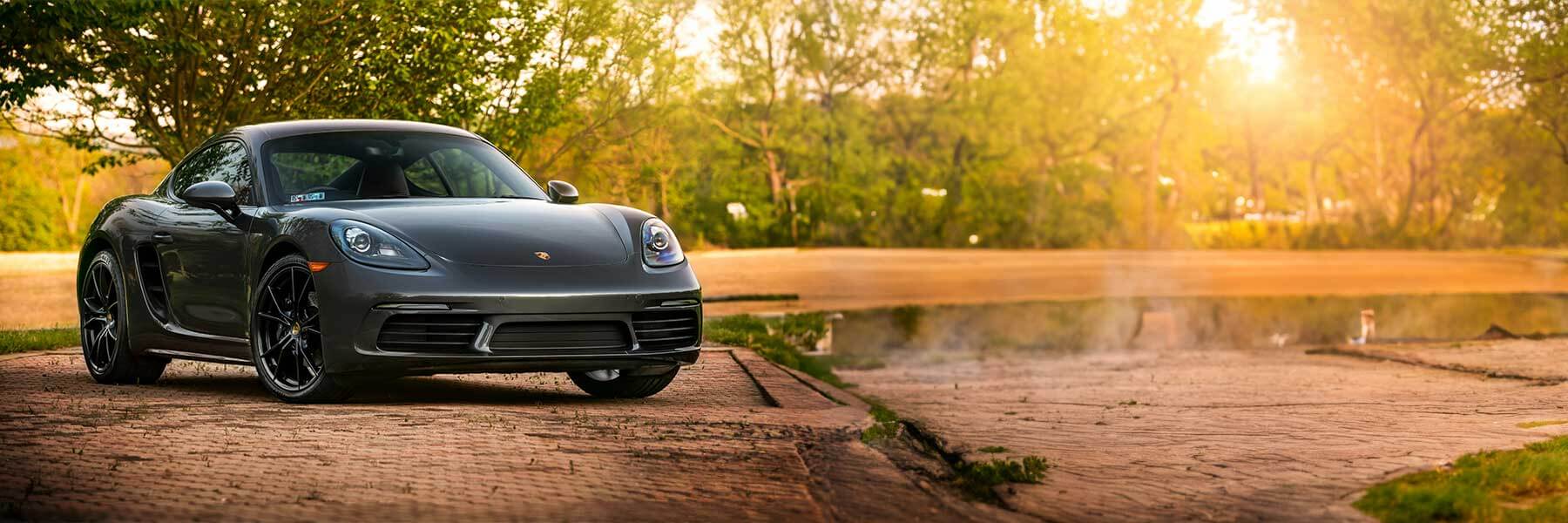 Featured banner showcasing the Porsche 718 Cayman with original Porsche wheels.