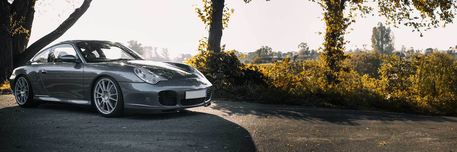 Featured banner showcasing the Porsche 996 (911) with original Porsche wheels.