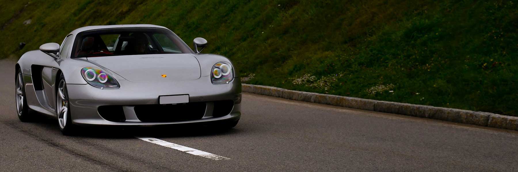 Featured banner showcasing the Porsche Carrera GT with original Porsche wheels.