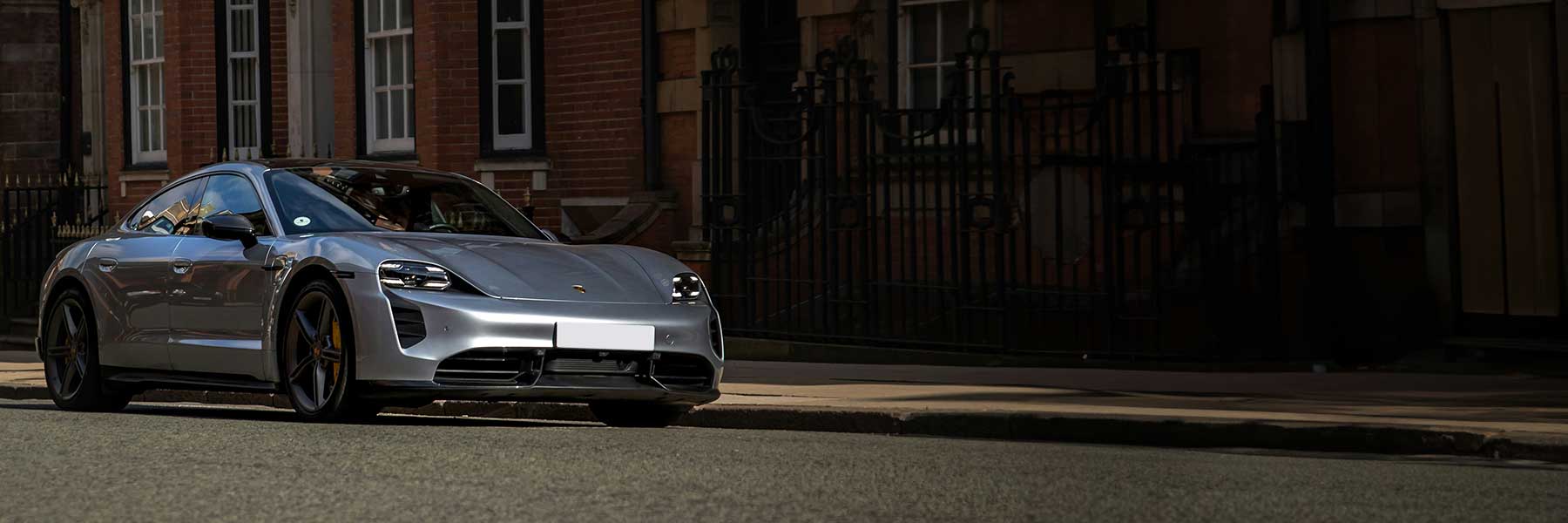 Featured banner showcasing the Porsche Taycan with original Porsche wheels.