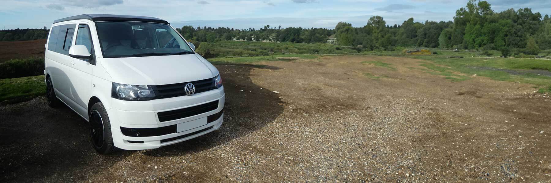 Banner image of a  VW Camper Van T5 7HK featuring original VW wheels.