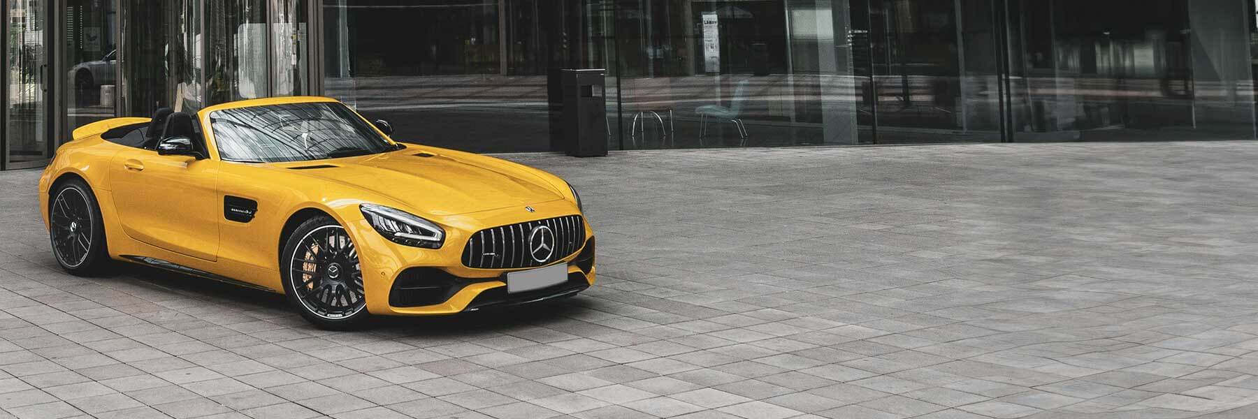 Banner image of vehicle featuring genuine AMG alloy wheels.