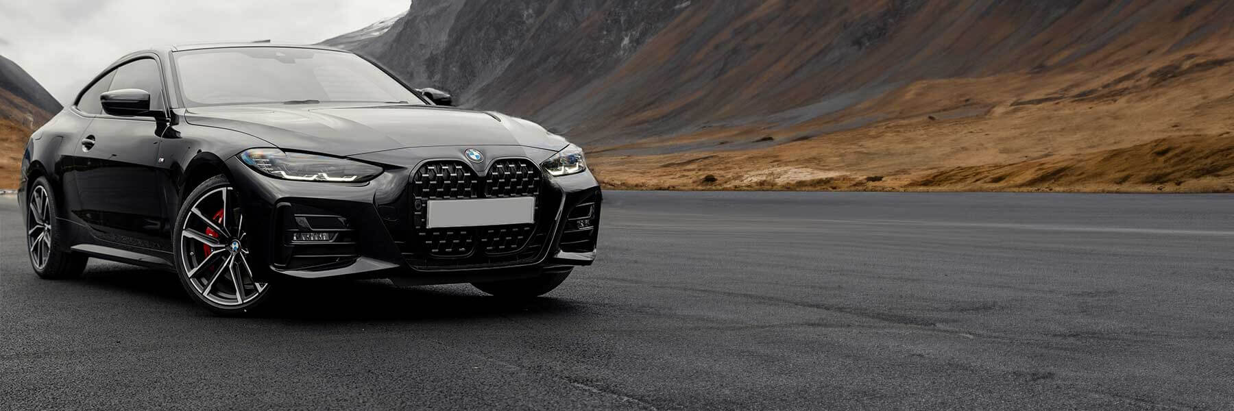 Banner image of vehicle featuring genuine BMW alloy wheels.
