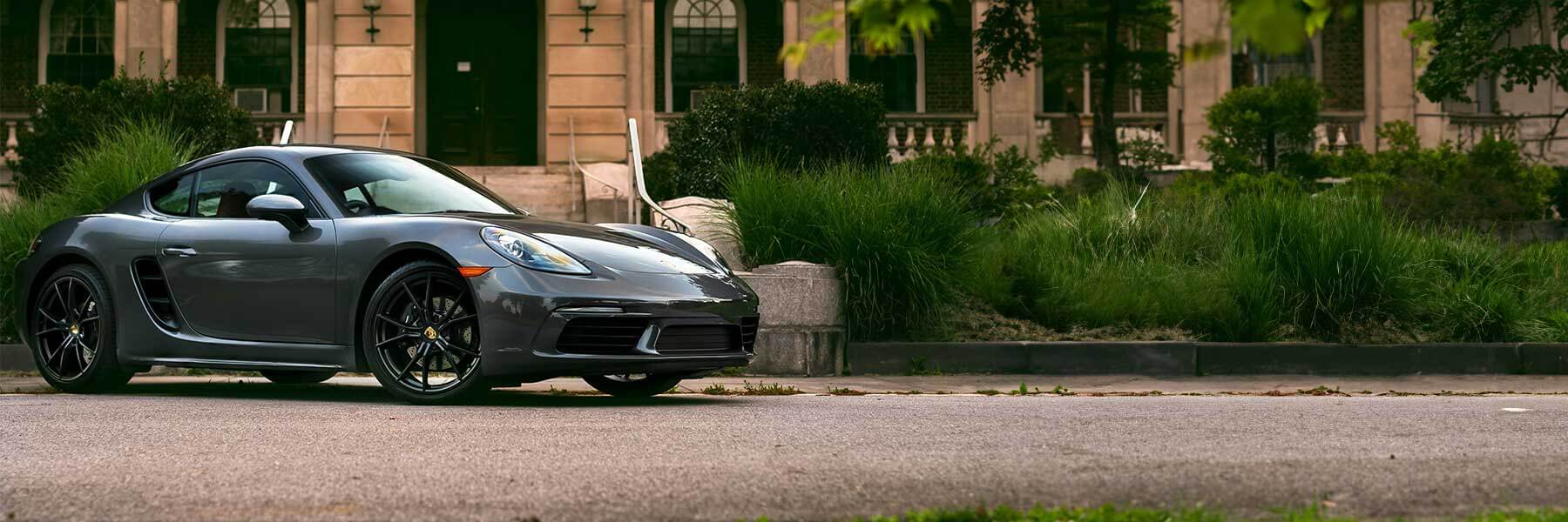 Banner image of vehicle featuring genuine Porsche alloy wheels.